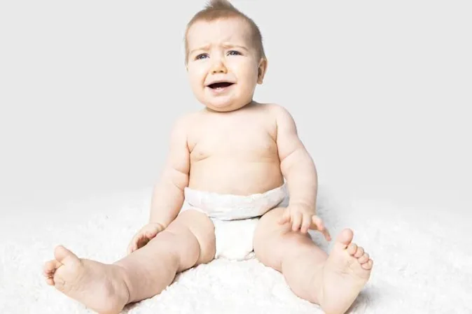 How did the baby tell her mom that she had a wet diaper? image