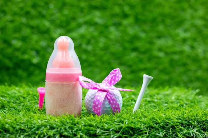 What did the golfer yell when his wife gave birth to their second child? image