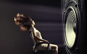 How does a witch play loud music? image