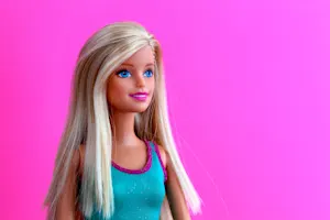 Which famous singer loves to play with Barbie™ dolls? image