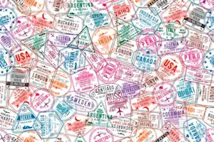 Who sits in a corner all day but somehow still travels the world? image