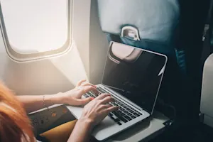 Why did the girl study in the airplane? image